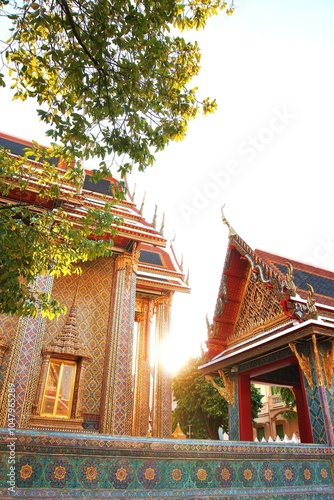 A beautiful sunrise through Wat Ratchabophit Sathitmahasimaram Ratchaworawihan, the most famous and invaluable Buddhist temple in Thailand. A symbol of Thai treasure, traditional, culture, Buddhism photo