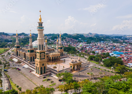 Aerial view of Baitul Muttaqien Mosque, the biggest mosque and islamic center in Samarinda, East Kalimantan, Indonesia. Located on the banks of the Mahakam River. photo