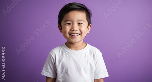 east asian kid boy purple background wearing plain white tshirt smiling happy portrait