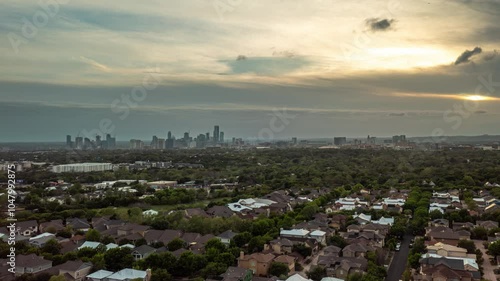 4K+ Aerial time-lapse over Mueller of Austin, Texas with a view of skyscrapers at sunset