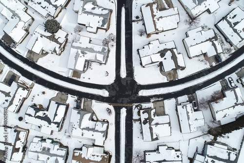Fotografie Aerial View of Snow-Covered Suburban Neighborhood in Winter