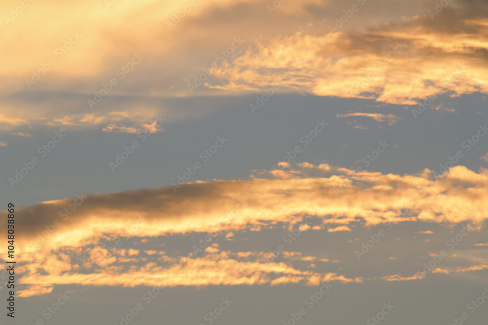 Obraz premium Orange And Yellow Colors Sunset Sky. Sunlight through clouds
