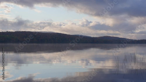 Wallpaper Mural Autumn lake reflections with gentle waves and clouds over tranquil waters Torontodigital.ca