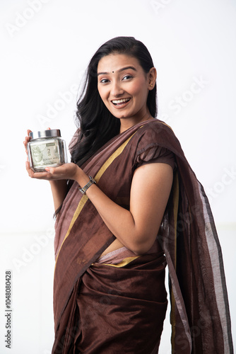 Alluring Woman Holding Glass Jar Full Of Rupee Notes
