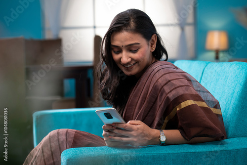 Mature Wife Using Smartphone And Scrolling Through Social Media
