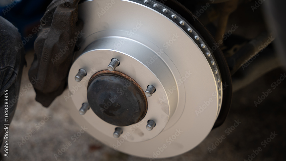 Mechanic in vehicle repair work, changing fluids and brake system Mechanic in vehicle repair work, changing fluids and brake system