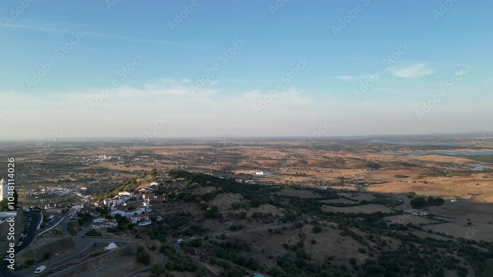 Aerial view of Portalegre, showcasing rolling hills and a vast horizon under a clear sky Aerial view of Portalegre, showcasing rolling hills and a vast horizon under a clear sky