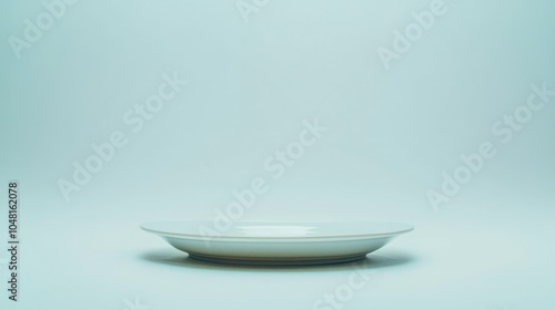 Simple Dessert on Plain Plate Against Light Background