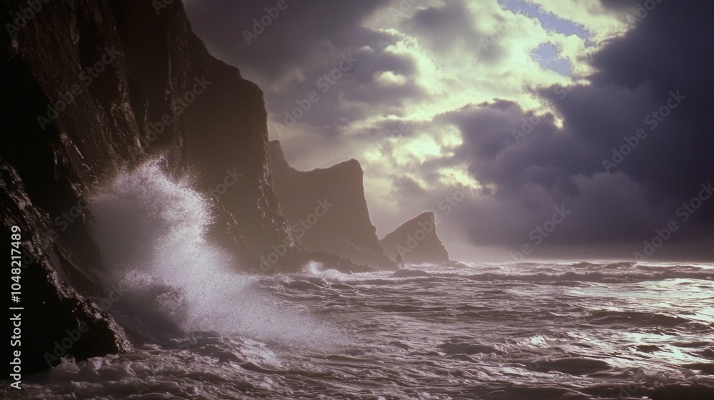 Obraz premium Majestic Coastal Landscape with Powerful Waves Crashing Against Rocky Cliffs under Ominous Storm Clouds and Sunset Glow