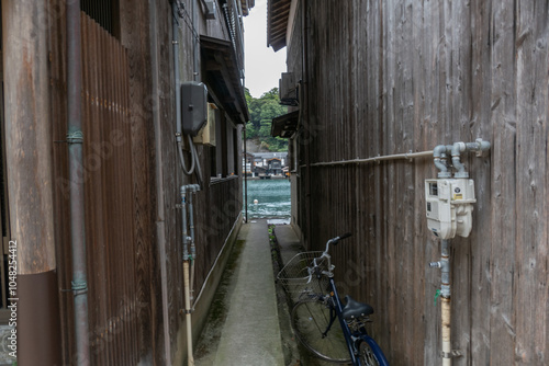 Ine Fishing Village, is famous for its unique funaya, or boat houses. These wooden buildings sit right on the water and serve as both dock and home for the fishermen photo