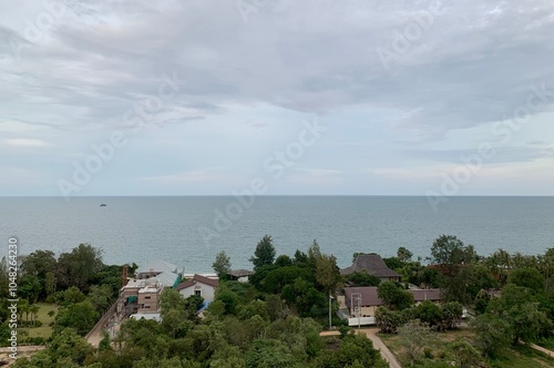 boat at sunset, view of the city, hill and ocean,  building and village on the beach Phetchabun Province Thailand, tower sea skyline, building sea with blue sky, Thailand photo