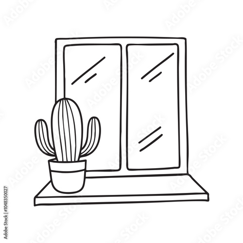 A cactus in a pot on the left side of a windowsill