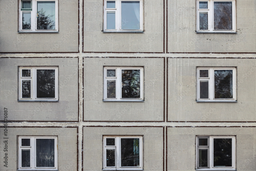 Obraz premium The old gray panel house. Texture and background