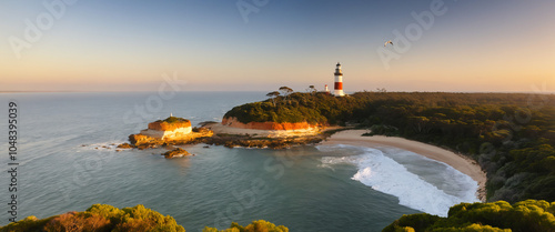 Generate an image of Point Nepean National Park in Victoria, Australia, at sunset, with the iconic Point Nepean Lighthouse standing tall in the foreground. photo