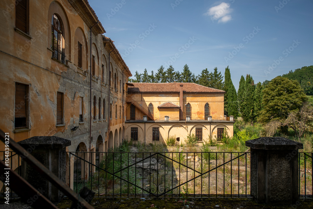 Fototapeta premium Forgotten Building in Northern Italy The Old Abandoned Seminary with a Blue Chapel