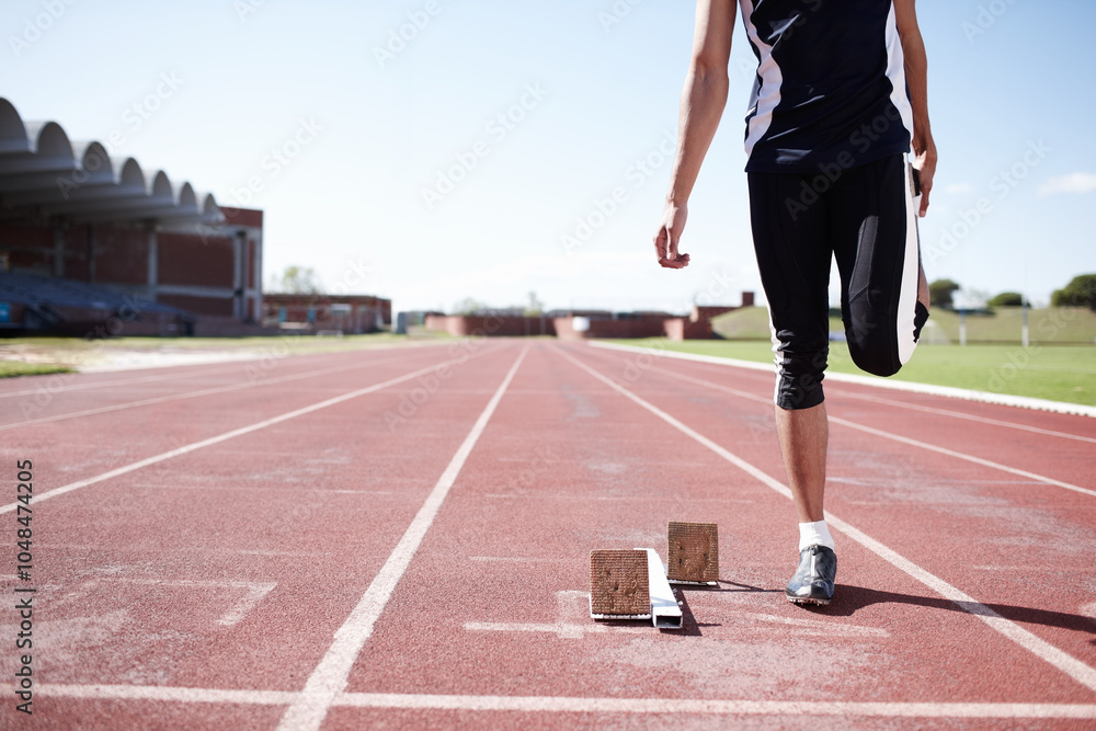 Man, legs and stretching on running track, warm up and preparation for exercise or workout. Male person, starting block and outdoor for fitness in sportswear, athlete and ready for marathon training Man, legs and stretching on running track, warm up and preparation for exercise or workout. Male person, starting block and outdoor for fitness in sportswear, athlete and ready for marathon training