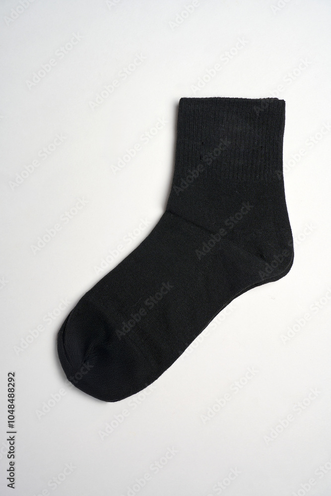 Black socks on a white background with copy space, close-up. New cotton socks advertisement Black socks on a white background with copy space, close-up. New cotton socks advertisement