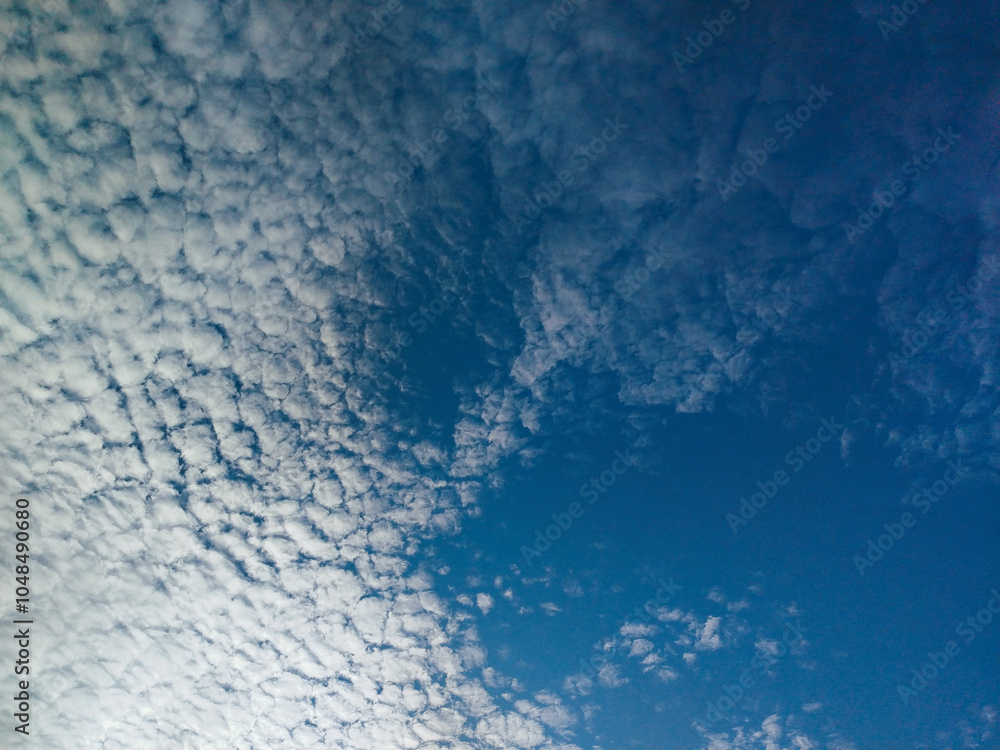 Mottled sky formed by Altocumulus stratiformis clouds.
fleece-shaped clouds and blue sky. cirrocumulus clouds. Indonesia Mottled sky formed by Altocumulus stratiformis clouds.
fleece-shaped clouds and blue sky. cirrocumulus clouds. Indonesia