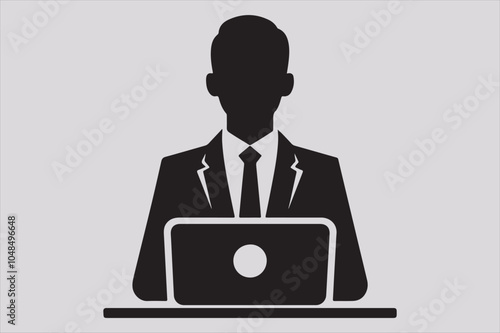 Silhouette of a person sitting behind a laptop.