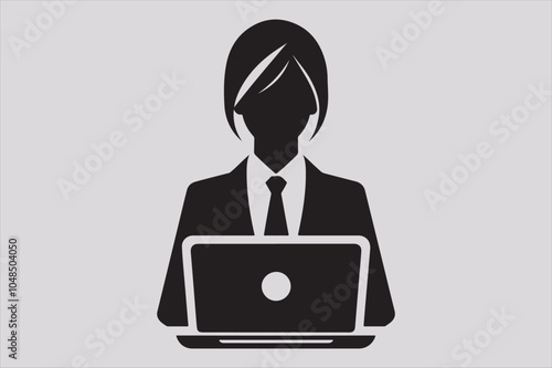 Silhouette of a person sitting behind a laptop.