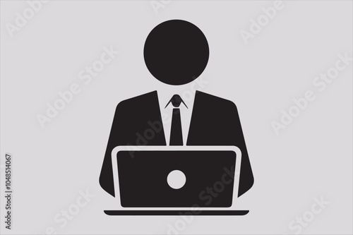 Silhouette of a person sitting behind a laptop.