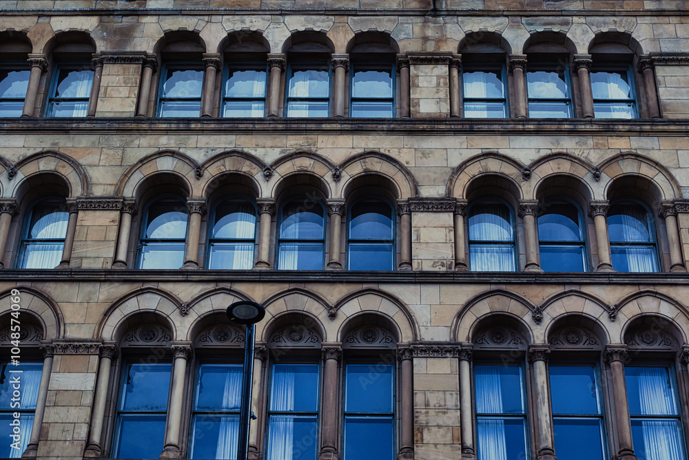 Obraz premium Stone Building Facade with Arched Windows