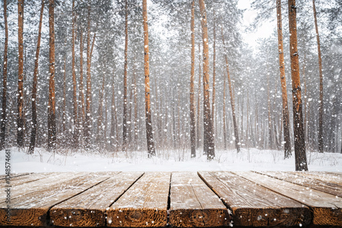 empty wooden table with copy space over snowy winter background photo