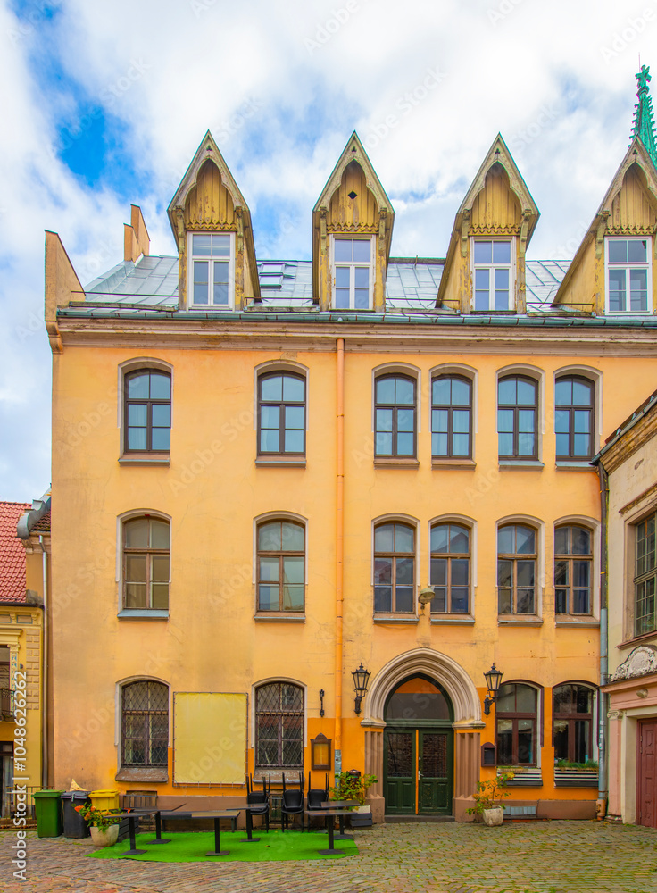 Fototapeta premium Old street in old Riga. The city is capital of Latvia that is well known to be a very popular tourism destination in the Baltic region