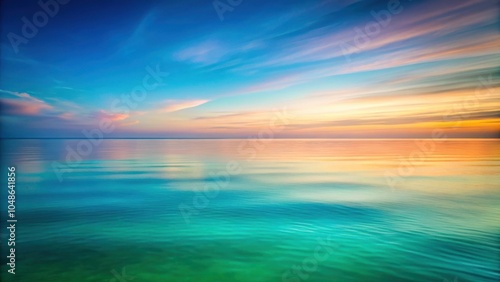 Serene Ocean at Sunset with a Vibrant Sky Reflected in the Calm Waters