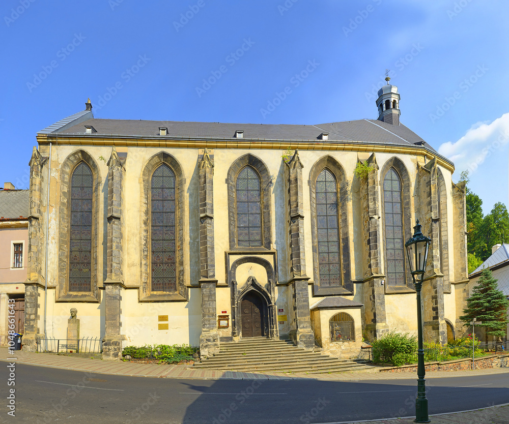 Obraz premium Krupka, Gothic Church of the Assumption of the Virgin Mary of the town in the valley of the Ore Mountains/Erzgebirge, Bohemia. Region in Germany (Saxony) and Czechia is UNESCO World Heritage