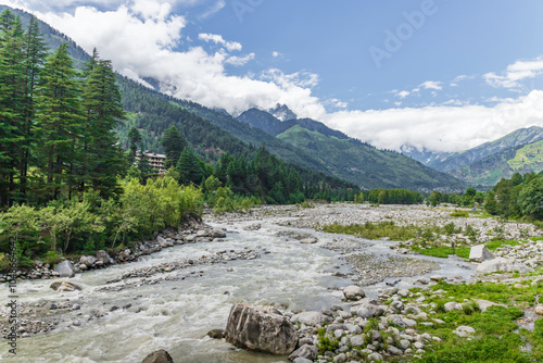 View of mountains and valleys of manali and beas river near Jogini waterfall in Himachal Pradesh India. photo