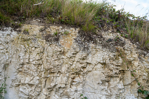 Sedimentary rock soil, composed of chalk, marl and limestone, on champagne vineyards in village Hautvillers in Marne valley, Champange, France, soil sample, nature soil background photo