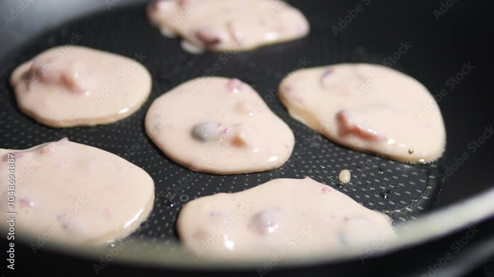 Cooking berry fritters pancakes. Close up. Healthy eating concept. Cooking berry fritters pancakes. Close up. Healthy eating concept.