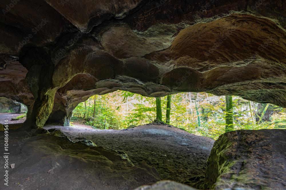 Obraz premium Scenic diversity of Mullerthal, Luxembourg's Little Switzerland, hiking routes, rock formations, moss-covered forests, tourist destination in Europe