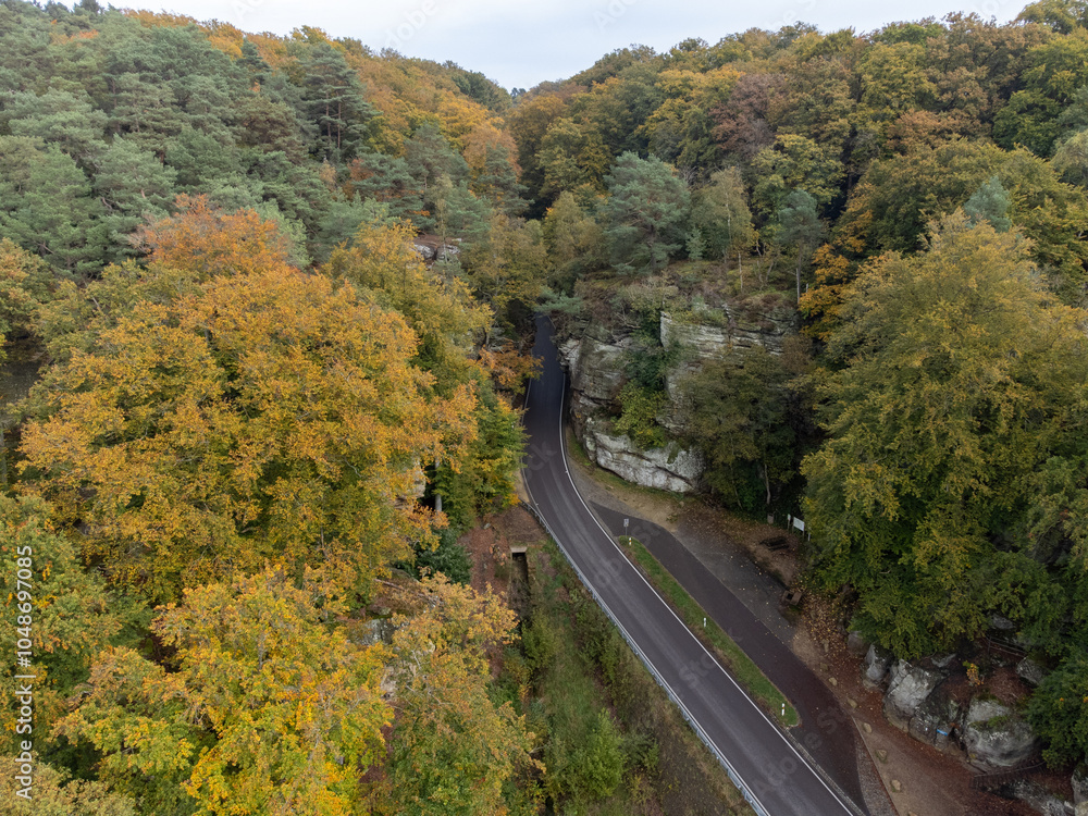 Fototapeta premium Aerial view on Mullerthal, Luxembourg's Little Switzerland, hiking routes, rock formations, moss-covered forests, tourist destination in Europe
