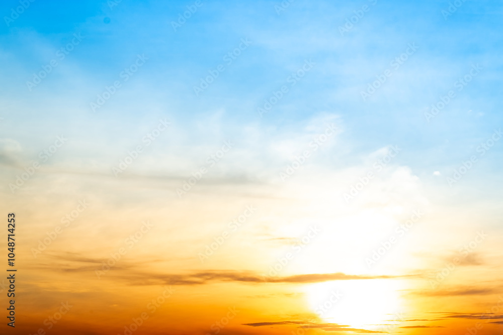 Fototapeta premium Beautiful , luxury soft gradient orange gold clouds and sunlight on the blue sky perfect for the background, take in everning,Twilight, Large size, high definition landscape photo