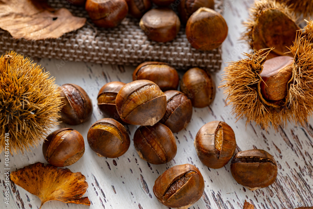 Chestnuts on a wooden table.
Tasty chestnuts image.
Chestnuts on a wooden table.
Tasty chestnuts image.