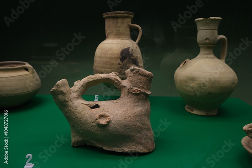 Ancient pottery artifacts displayed in a museum exhibit showcasing early ceramic techniques and historical craftsmanship photo