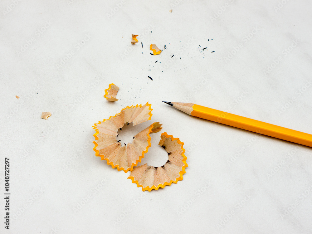 Fotografie Wooden sharpened pencil on marble background.