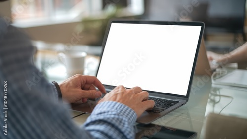 Man Working on Laptop in Cafe with Coffee - Close-Up Views of Hands Typing and Engaging with Laptop on a Wooden Table with Coffee Cup in Modern Coffee Shop