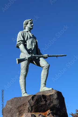 The minuteman statue stands proud over Lexington battlefield green, October 2024