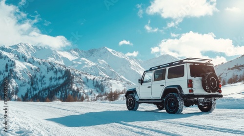 A white SUV parked on a snowy landscape with mountains in the background.