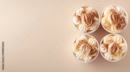 Wallpaper Mural Four creamy desserts with a sprinkle of cinnamon in clear plastic cups on a beige background. Torontodigital.ca