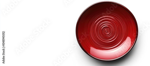 Red ceramic plate featuring...