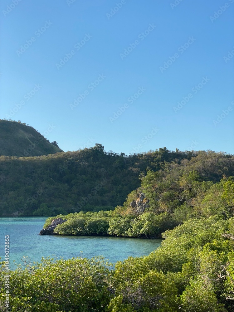 Green hills and blue ocean on a sunny day Green hills and blue ocean on a sunny day