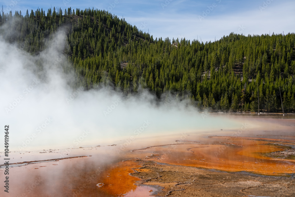 an active geyser spring with an intermittent discharge of water ejected turbulently and accompanied by steam an active geyser spring with an intermittent discharge of water ejected turbulently and accompanied by steam