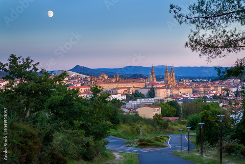 Santiago de Compostela skyline at dusk with view of cathedral and full moon
