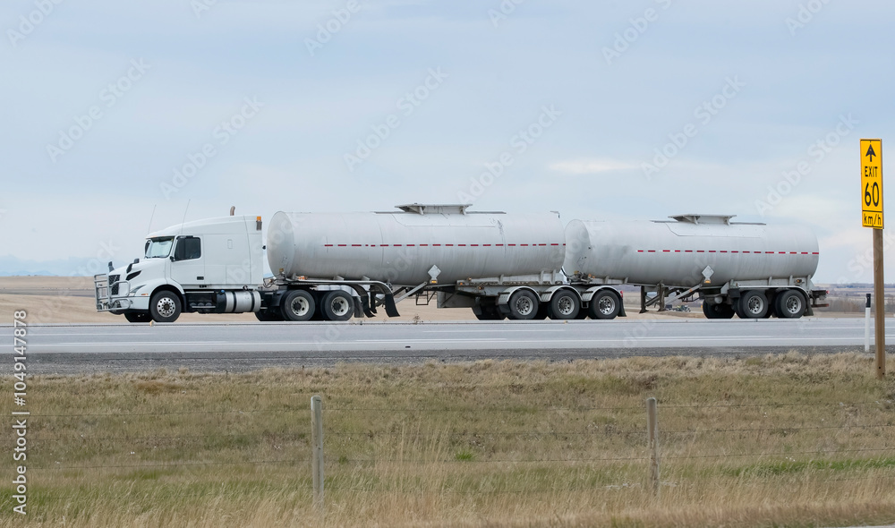 Fototapeta premium Heavy Cargo on the Road. A truck hauling freight along a highway. 
