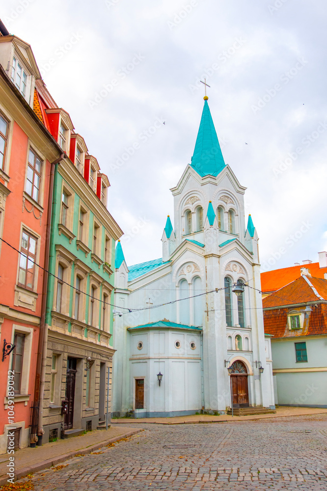Obraz premium Old street in old Riga. The city is capital of Latvia that is well known to be a very popular tourism destination in the Baltic region