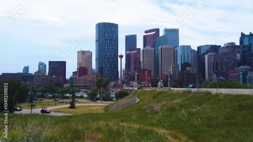 Calgary City - Downtown Skyline - Highway Traffic - Summer Day -  LS View 4K - Mt Pleasant Hill View Point - Alberta Province - Western Canada - North America photo